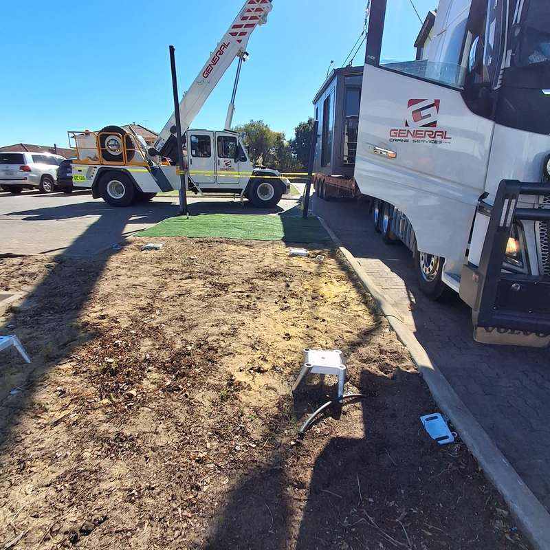 KOOLARK HOMES module delivery context with General Crane Services vehicles, crane equipment and prepared footing points