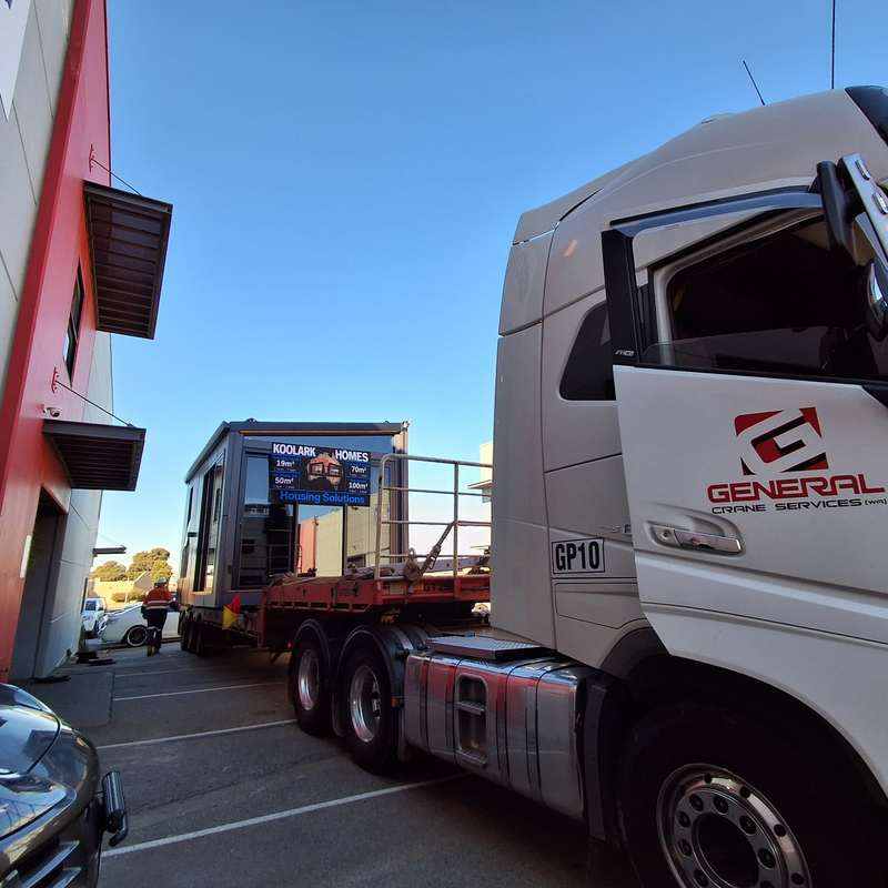 General Crane Services truck alongside a KOOLARK HOMES module transport and delivery setup