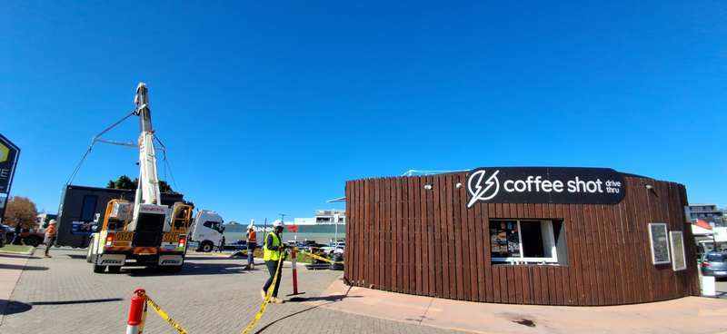 The Coffee-Shot HomeBase invitation beside KOOLARK HOMES lifting operations at Homebase Subiaco