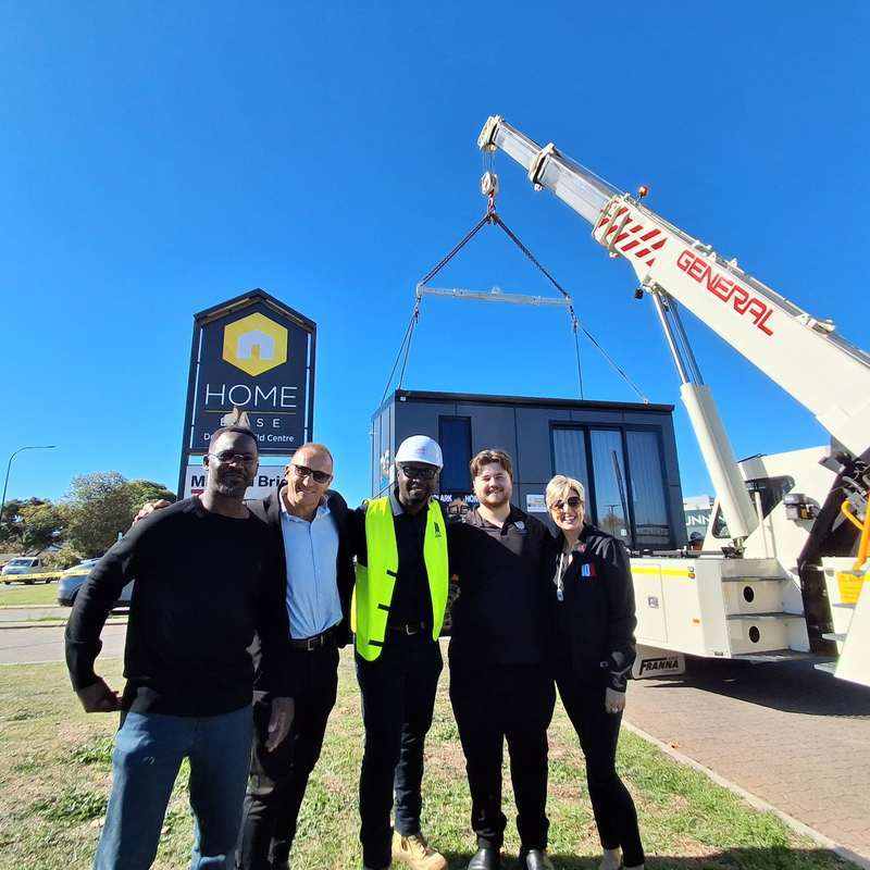 KOOLARK HOMES friends, partners and supporters with General Crane Services lifting equipment during Homebase delivery