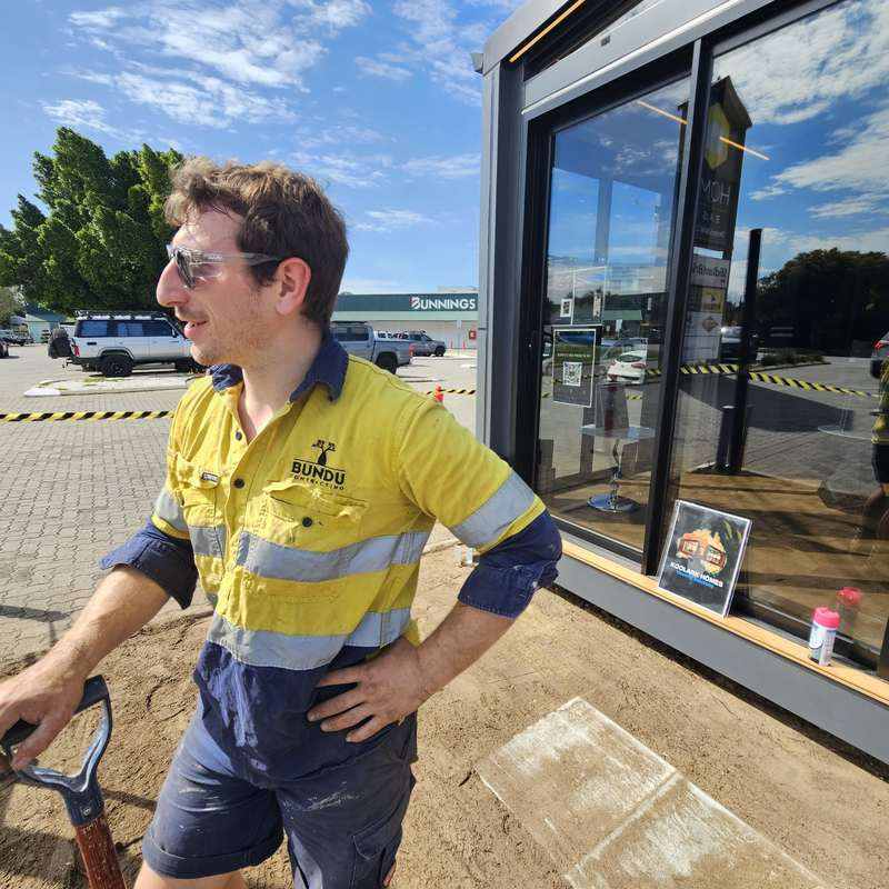 KOOLARK HOMES modular homes display exterior at Homebase Subiaco with an unidentified Bundu Contracting worker and Bunnings Subiaco visible.