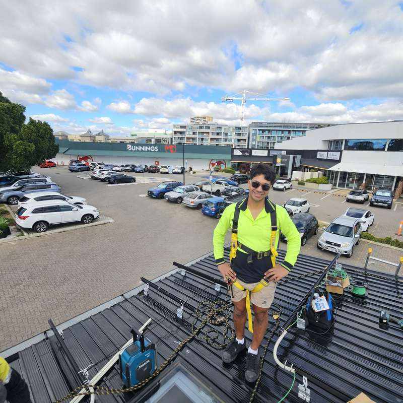 Power Source Solar & Batteries technician on a KOOLARK HOMES rooftop solar installation with Anker SOLIX energy-storage context