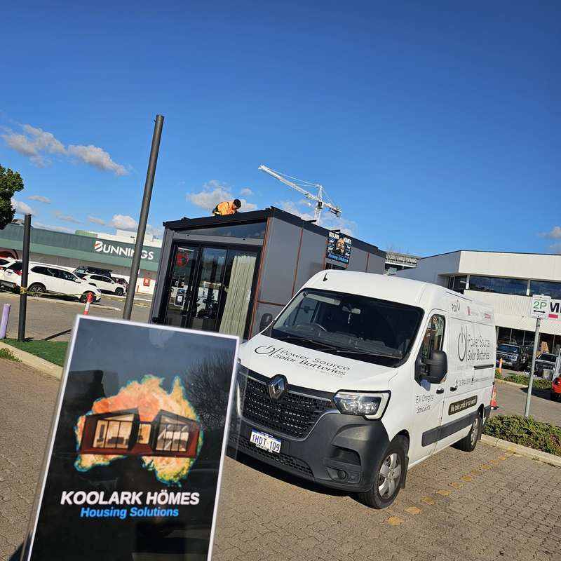 Power Source Solar & Battery local partner beside the KOOLARK HOMES Homebase display