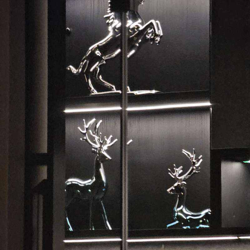 KOOLARK HOMES black glossy feature panels with metallic silhouette artwork