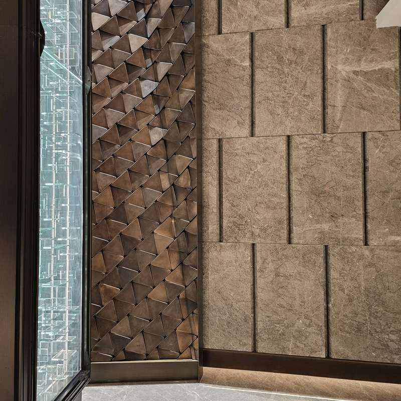 KOOLARK HOMES premium interior feature wall with stone tiles, geometric brown tiles and illuminated glass shelving