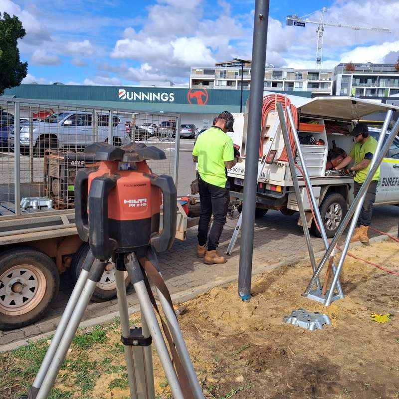 KOOLARK HOMES installation context with Surefoot vehicle, survey equipment and footing components