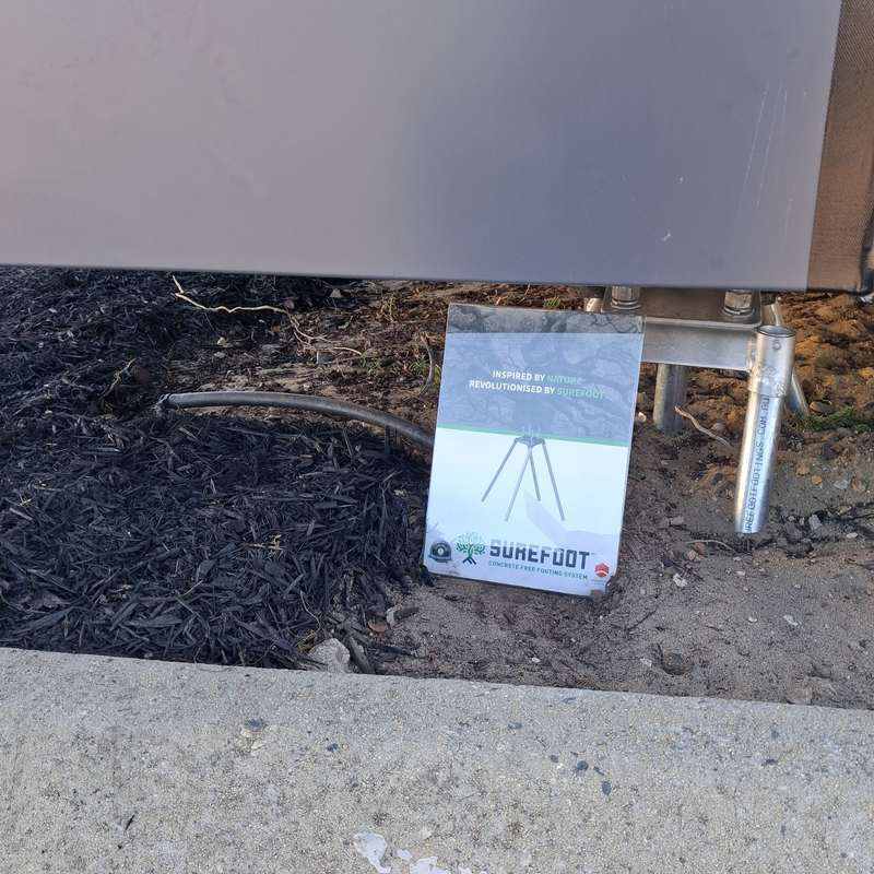 KOOLARK HOMES display module footing with Surefoot Concrete Free Footing System sign